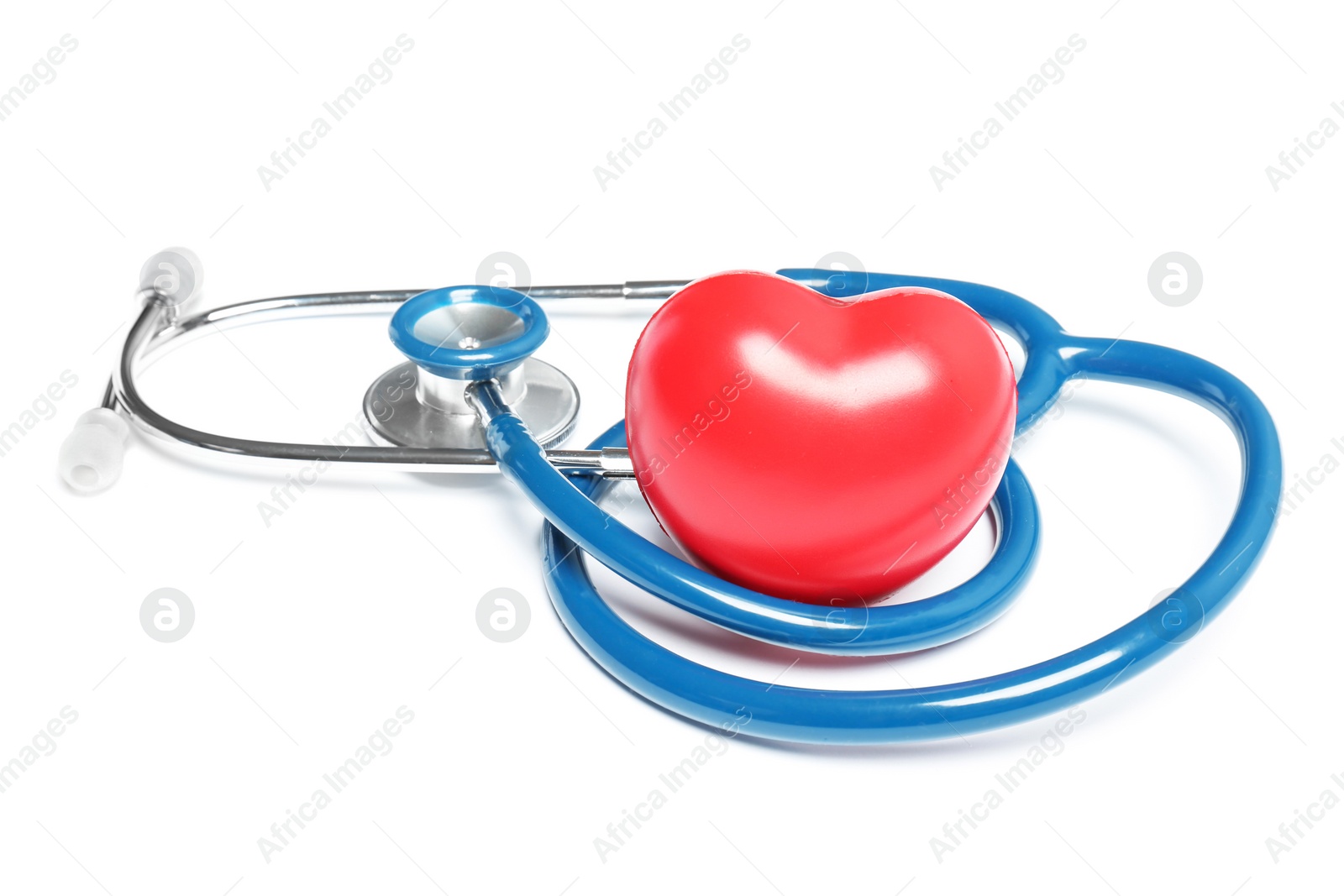 Photo of Stethoscope and heart model on light background. Medical equipment