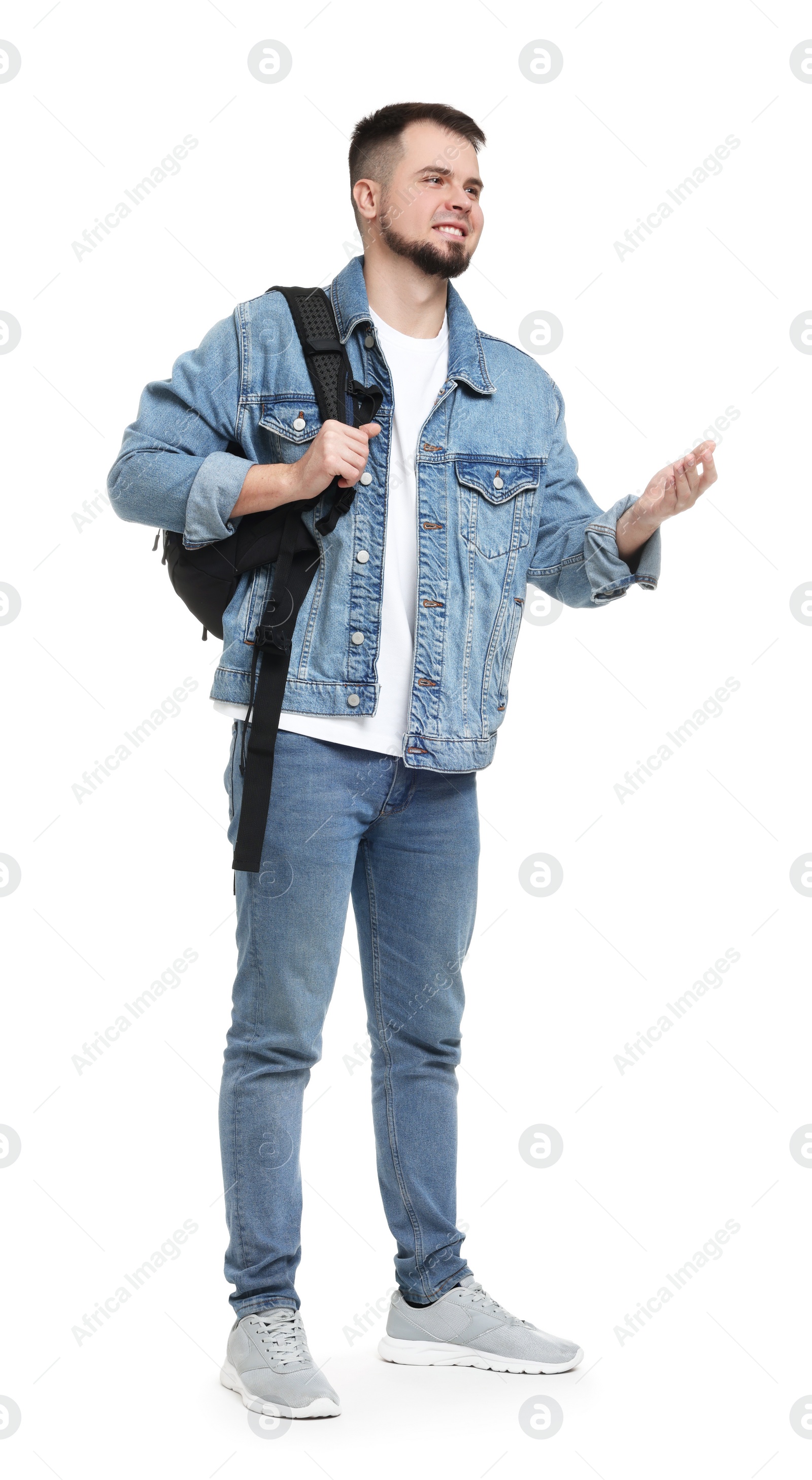 Photo of Man with backpack in denim clothes isolated on white