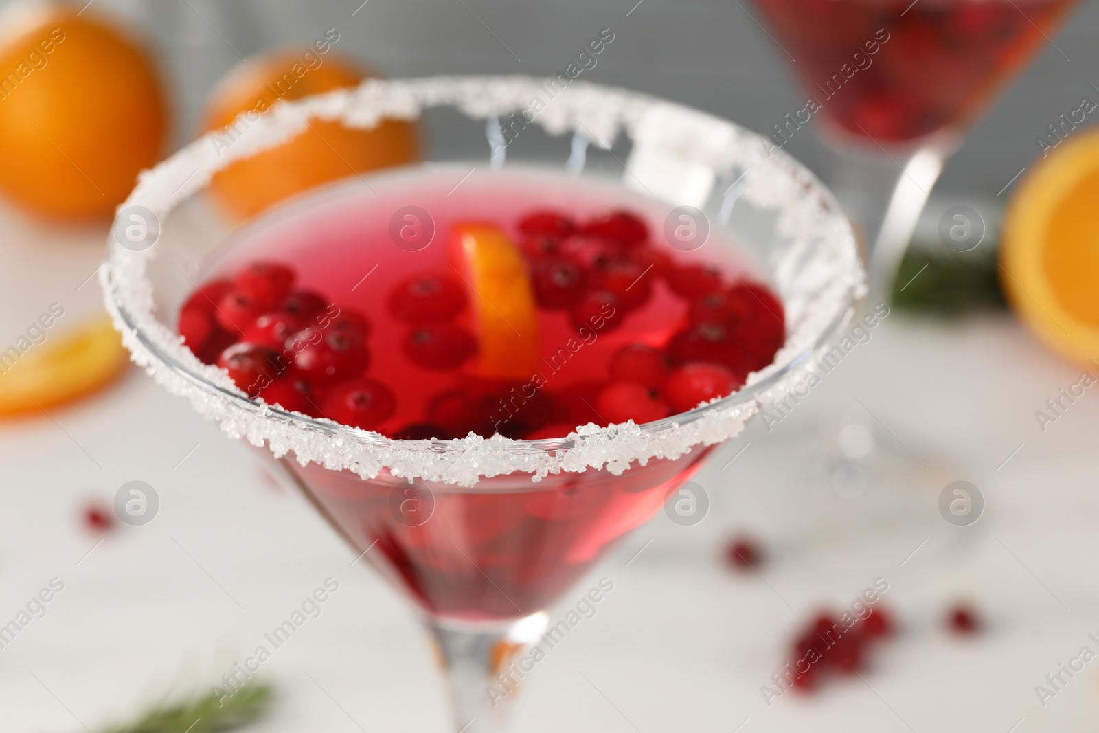 Photo of Tasty cranberry cocktail in glass on white background, closeup