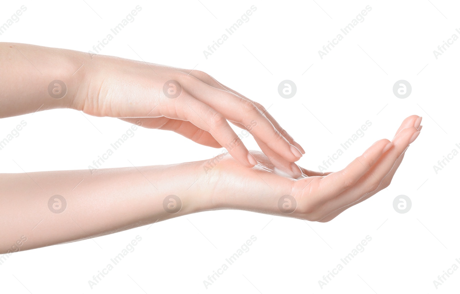 Photo of Woman applying cream on her hand against white background, closeup