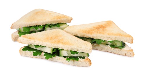 Tasty sandwiches with cucumber and parsley on white background