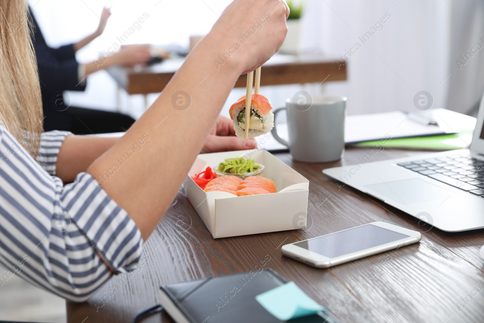 Photo of Office employee having lunch at workplace, closeup. Food delivery