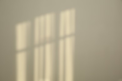 Photo of Light and shadows from window on wall indoors