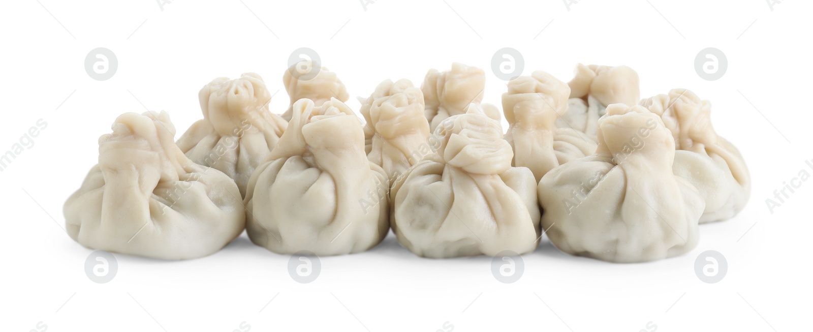 Photo of Many tasty khinkali (dumplings) isolated on white. Georgian cuisine