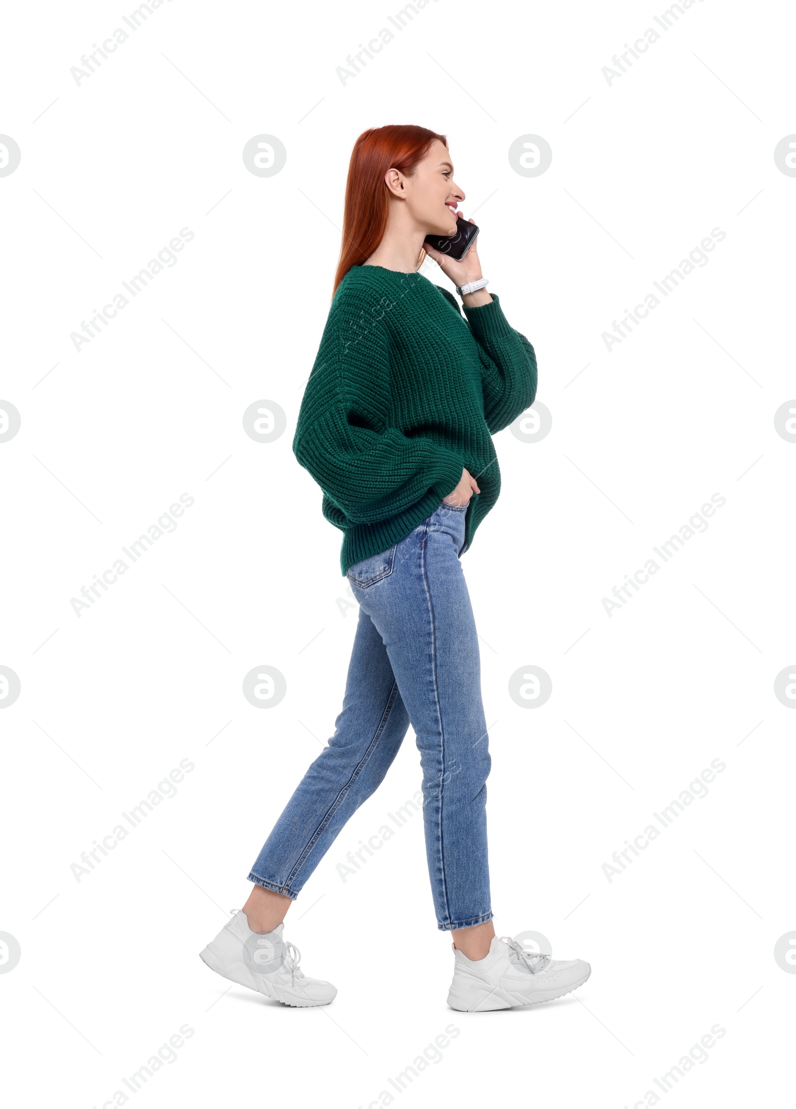 Photo of Happy woman talking on smartphone against white background