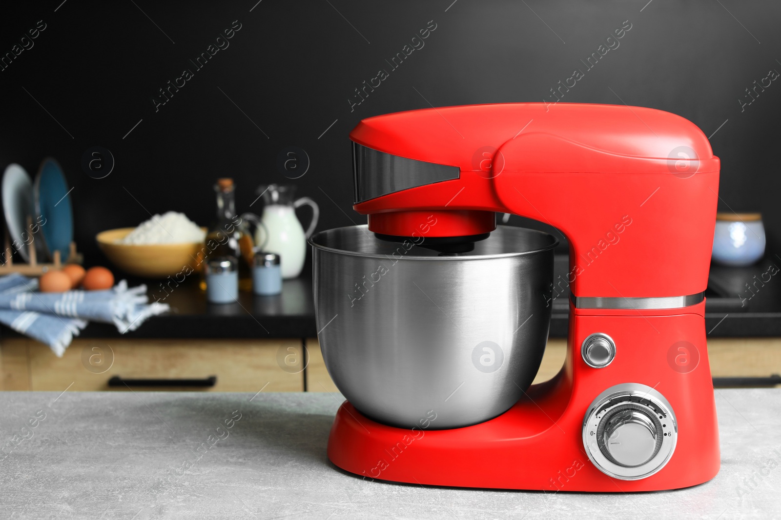 Photo of Modern stand mixer on table in kitchen. Space for text