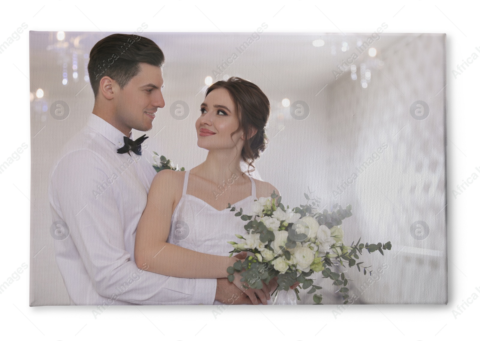 Image of Photo printed on canvas, white background. Happy newlywed couple together in festive hall