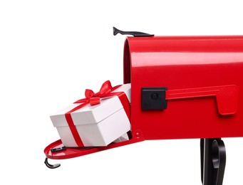 Photo of Red mailbox with Christmas gift isolated on white. Sending present by mail