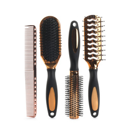 Set of professional hair brushes and comb isolated on white, top view