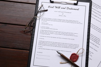 Photo of Last Will and Testament with wax seal, glasses and pen on wooden table, flat lay. Space for text