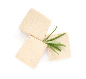 Photo of Delicious tofu and rosemary on white background, top view