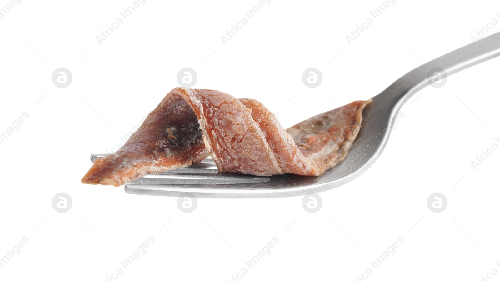Photo of Fork with delicious anchovy fillet isolated on white
