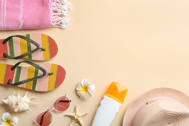 Photo of Flat lay composition with beach accessories on color background. Space for text