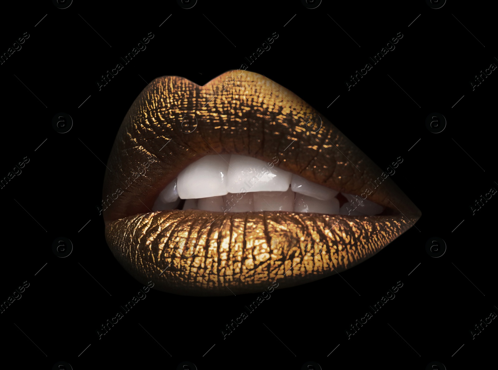 Image of Beautiful lips with shiny golden lipstick on black background