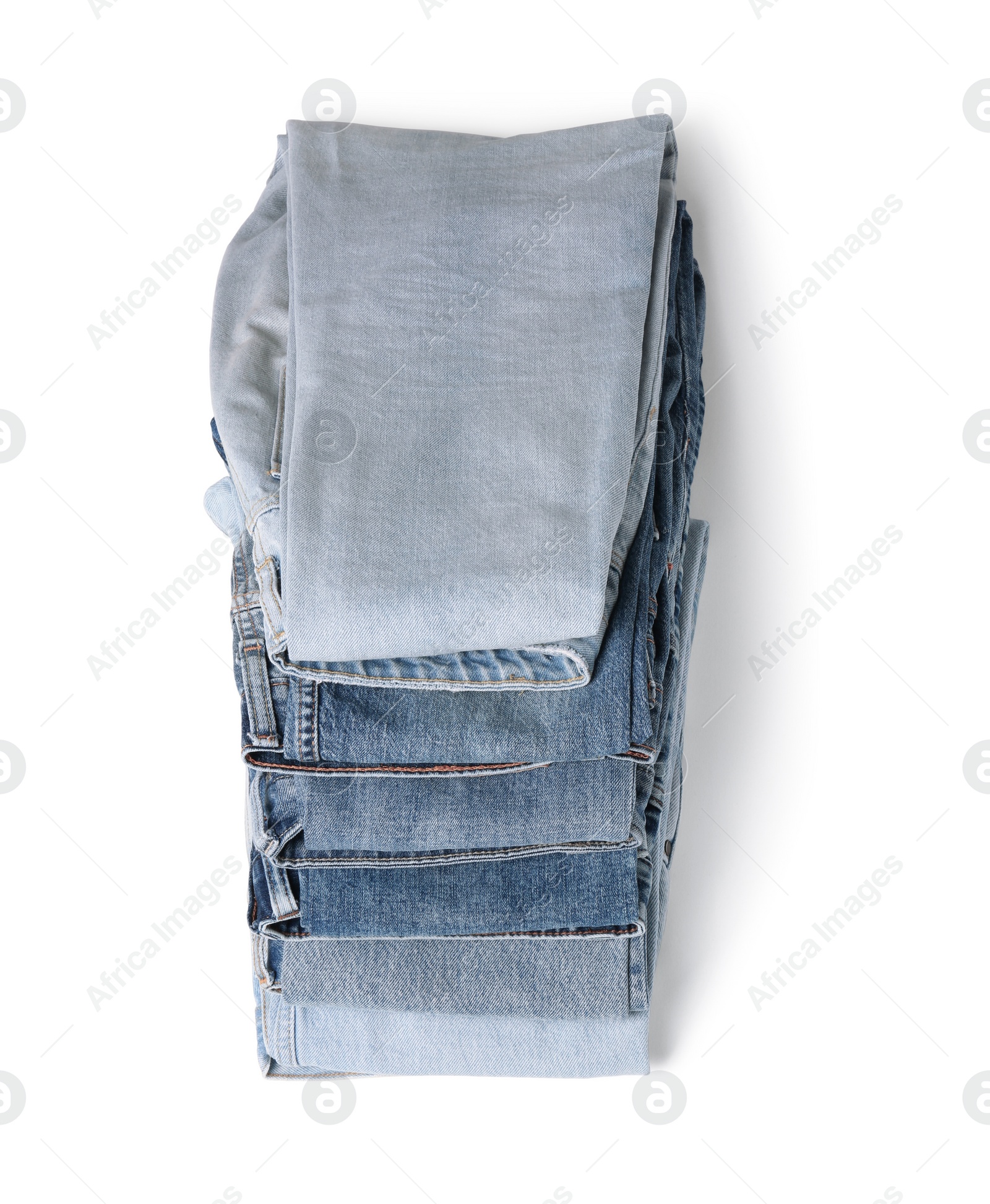 Image of Stack of different folded jeans isolated on white