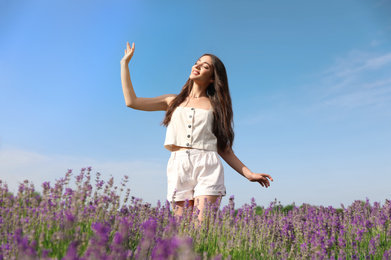 Young woman in lavender field on summer day