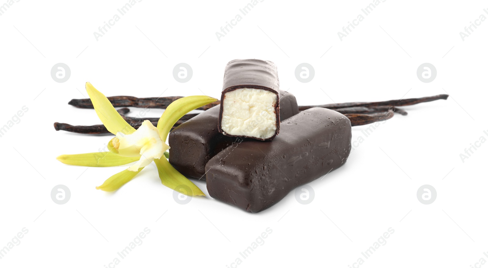 Photo of Glazed curd cheese bars, vanilla pods and flower isolated on white