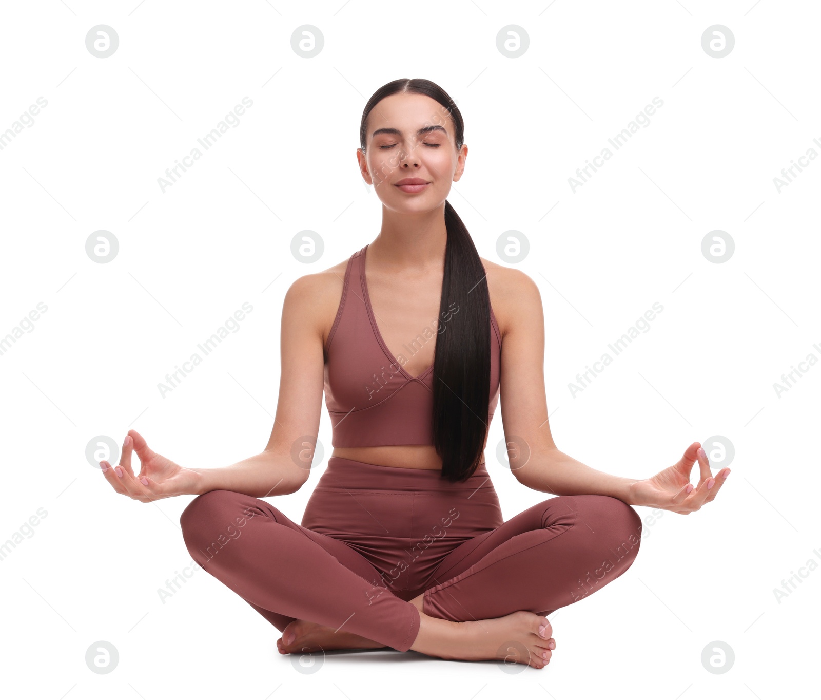 Photo of Beautiful young woman practicing yoga on white background. Lotus pose