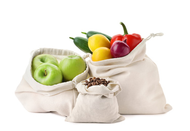 Photo of Cotton eco bags with fruits, vegetables and coffee beans isolated on white