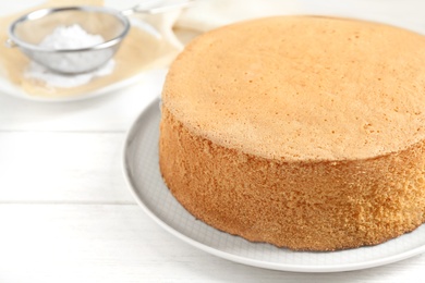 Photo of Delicious fresh homemade cake on white wooden table