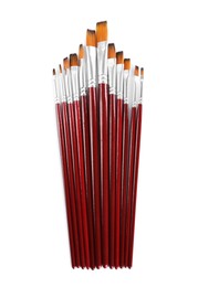 Photo of Set of paintbrushes on white background, top view