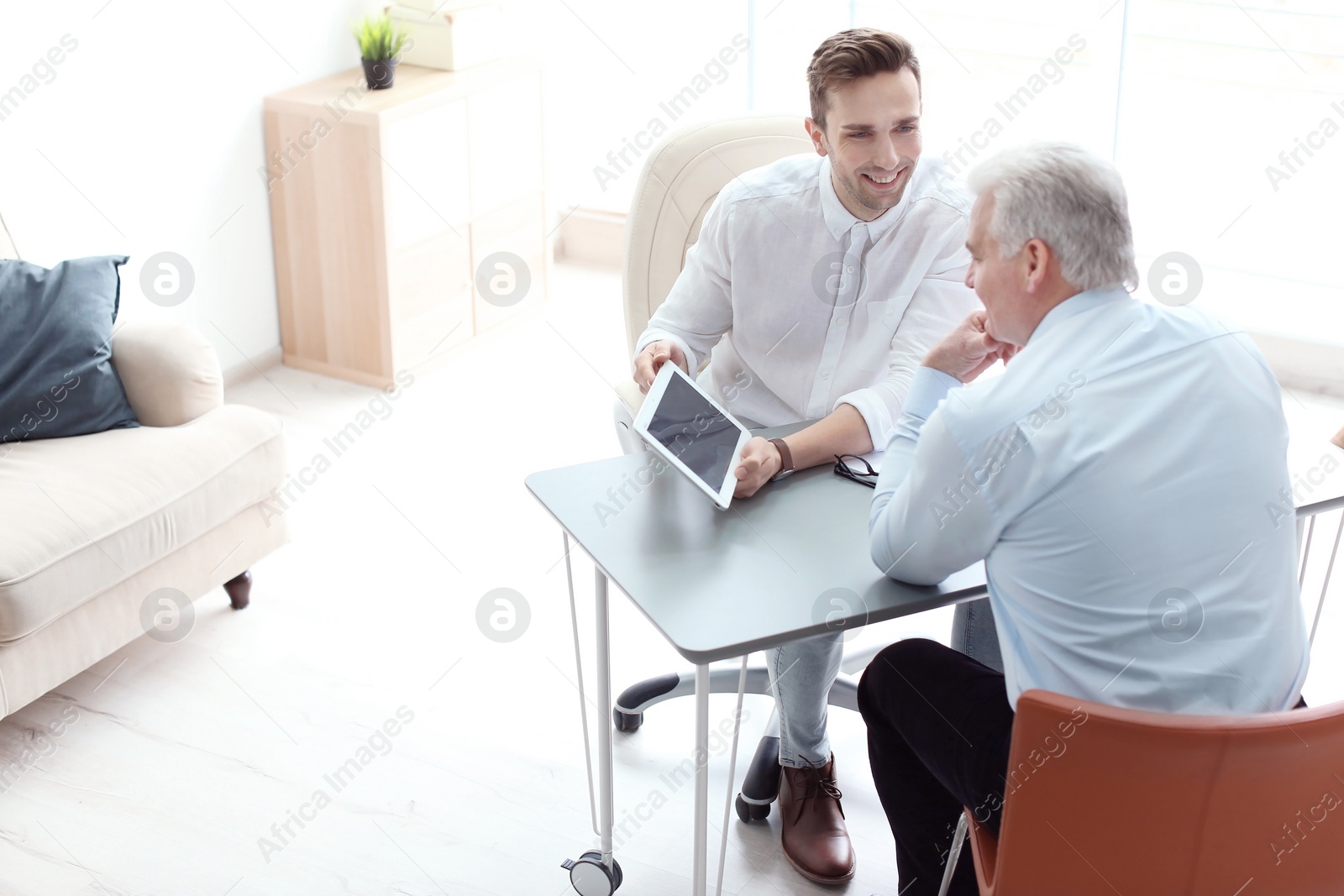 Photo of Human resources manager conducting job interview with applicant in office