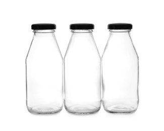 Photo of Closed empty glass bottles isolated on white