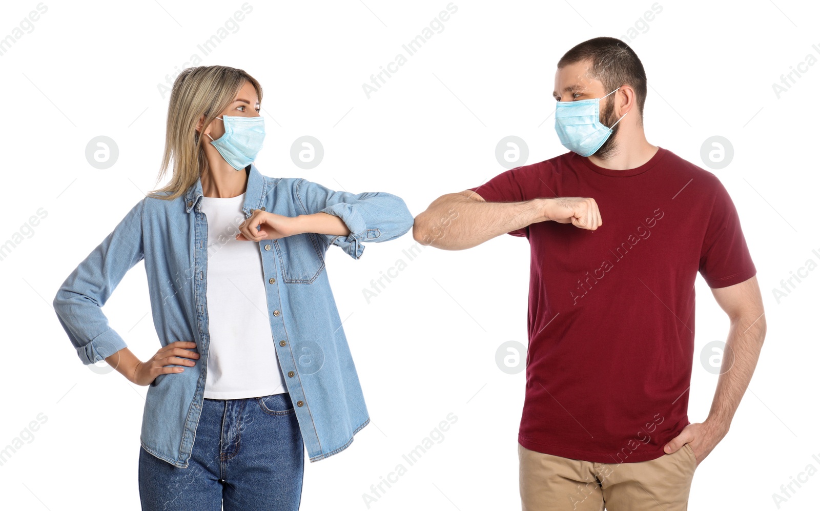 Photo of Man and woman bumping elbows to say hello on white background. Keeping social distance during coronavirus pandemic