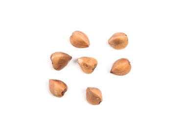 Photo of Uncooked buckwheat on white background, top view