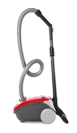 Modern red vacuum cleaner isolated on white