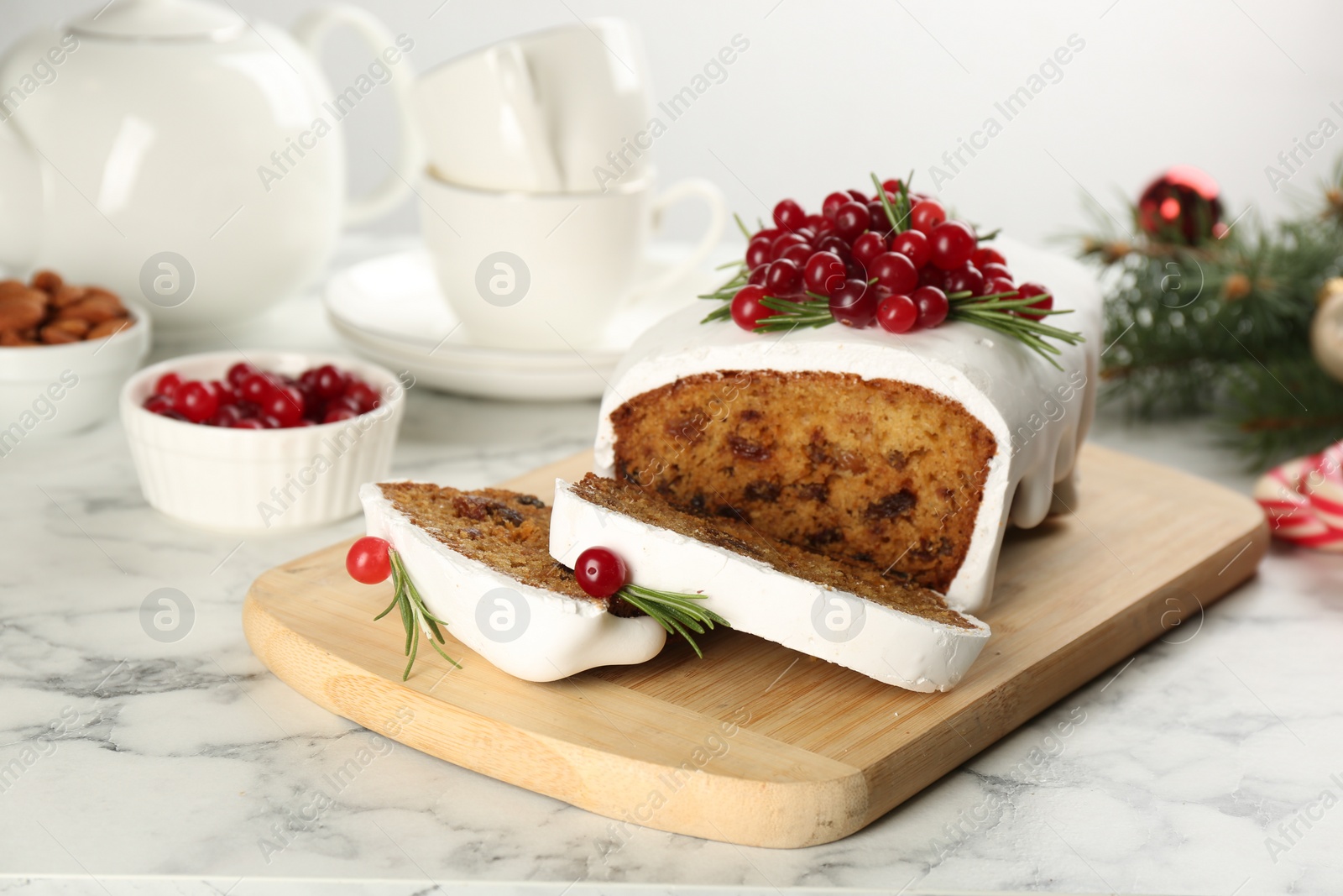 Photo of Traditional Christmas cake on white marble table. Classic recipe