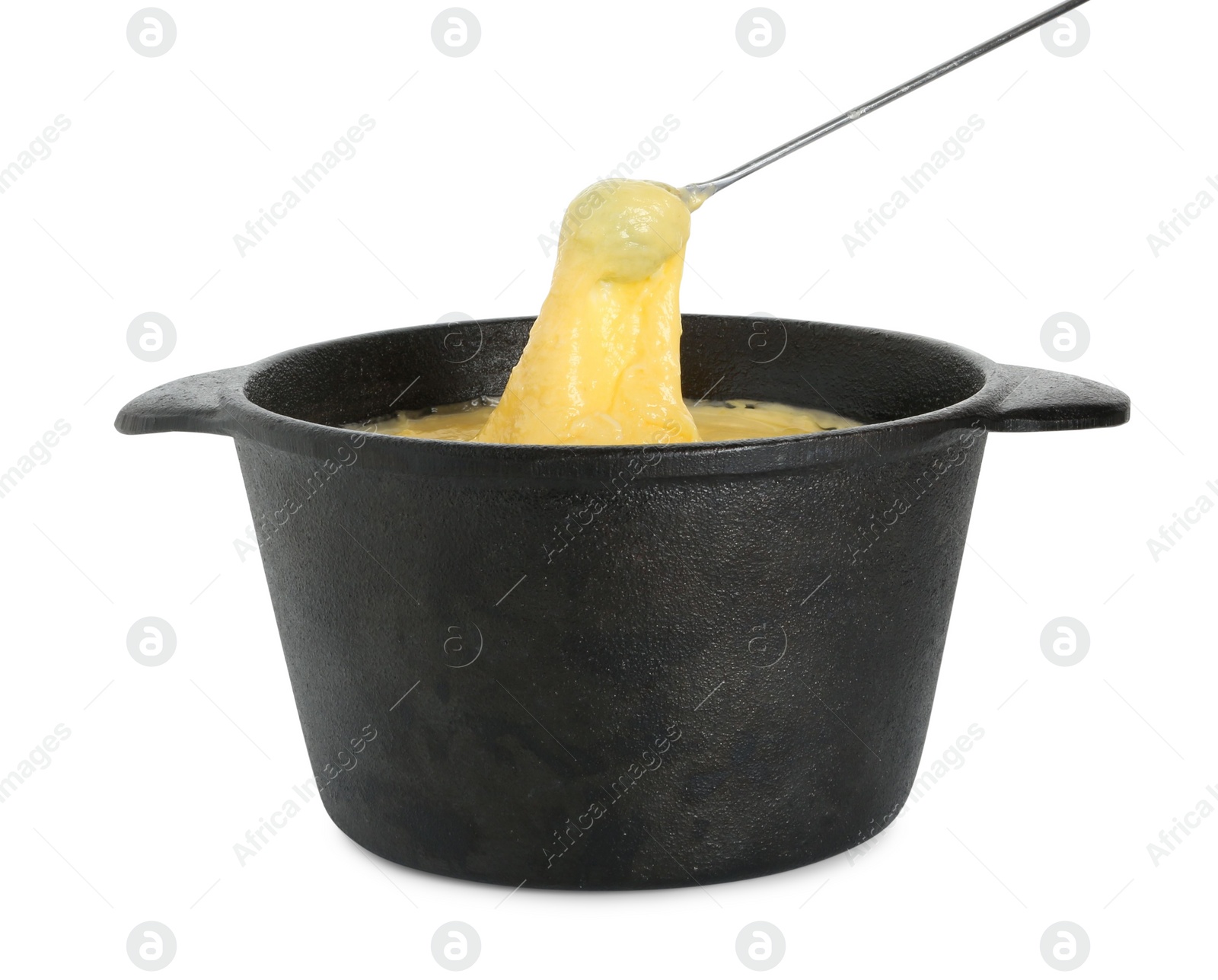 Photo of Dipping grape into fondue pot with tasty melted cheese isolated on white