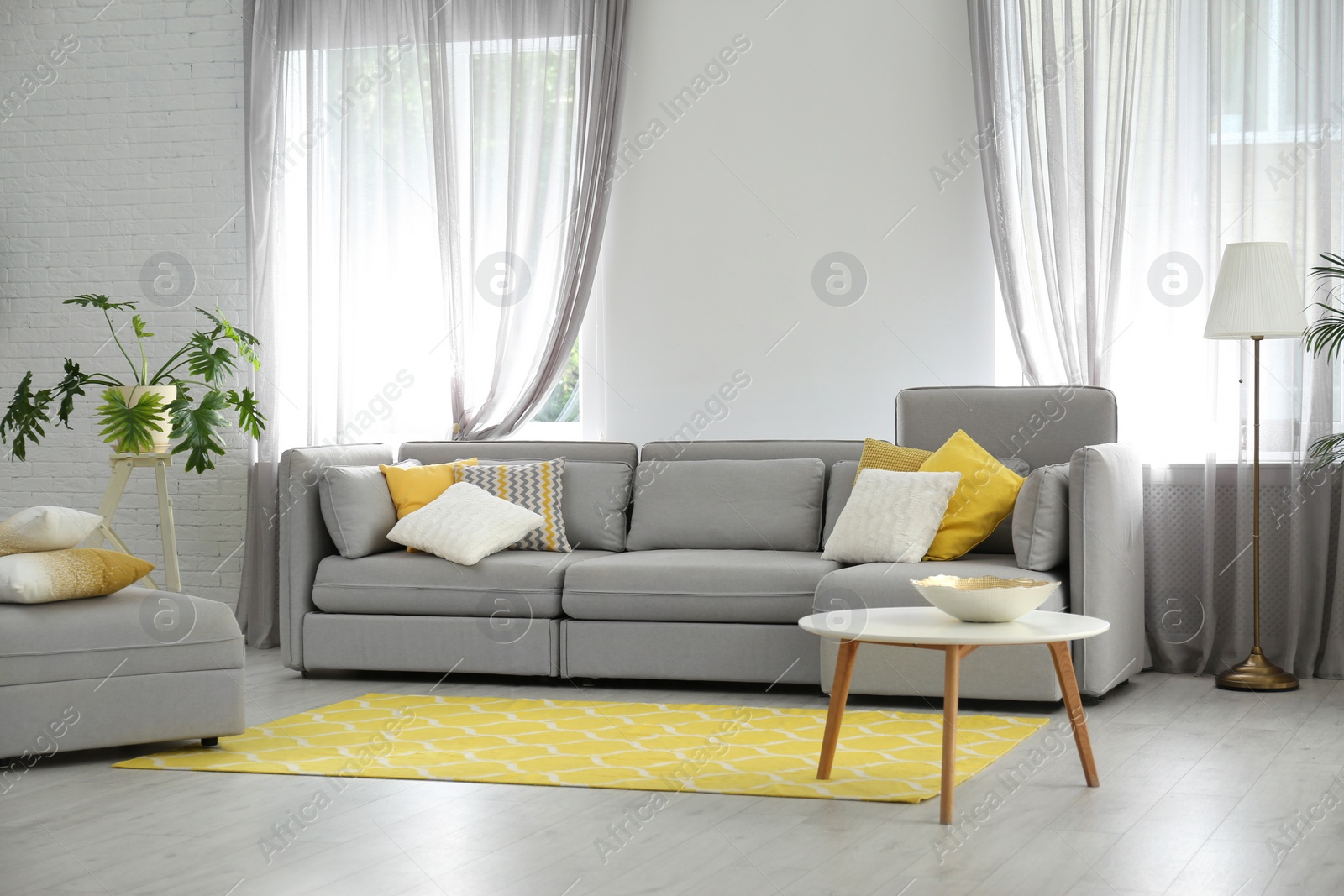 Photo of Living room with comfortable sofa and stylish decor. Idea for interior design