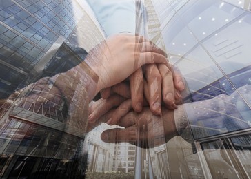 Image of Partnership concept. Double exposure of people joining hands together and cityscape.