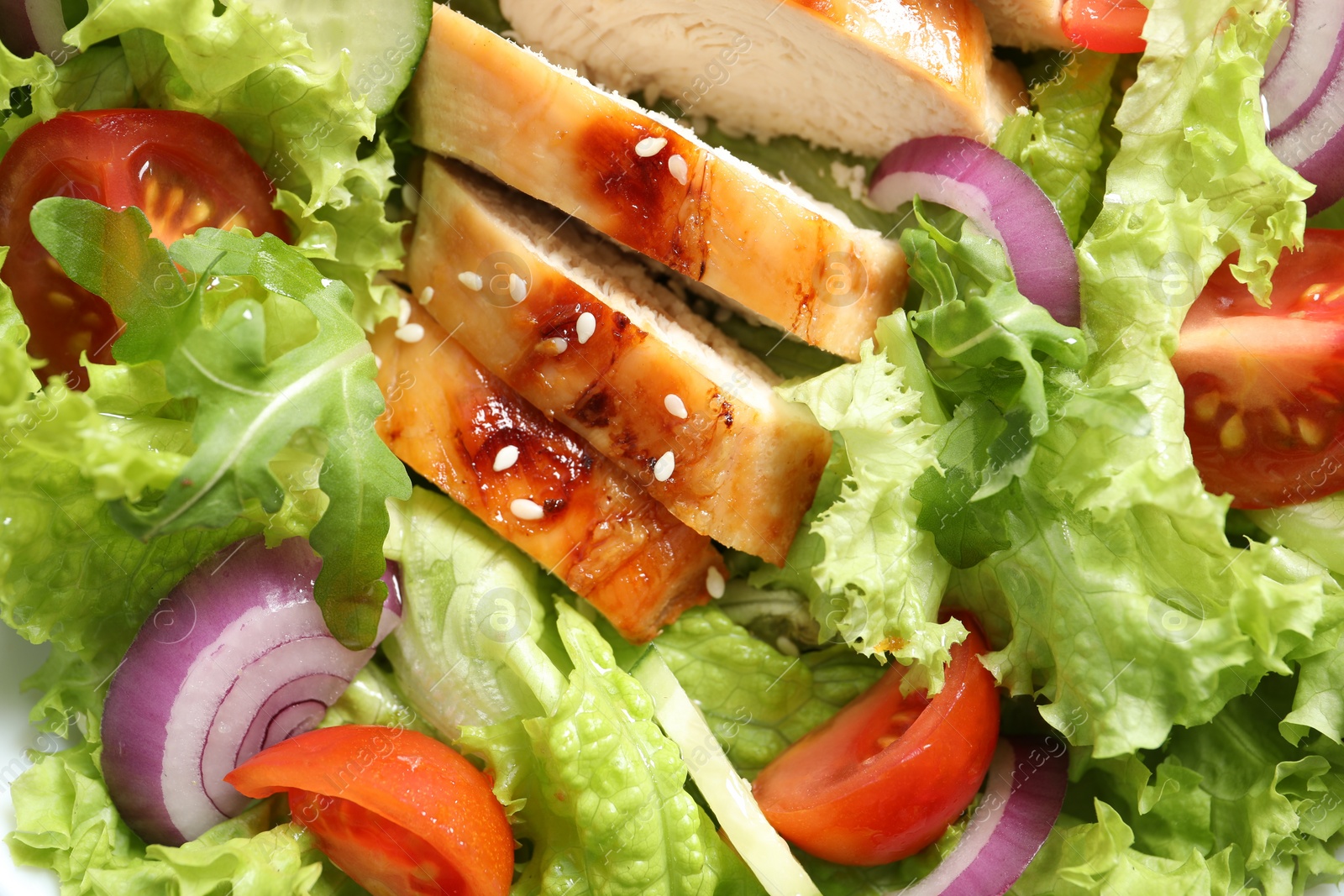 Photo of Delicious salad with chicken and vegetables as background, top view