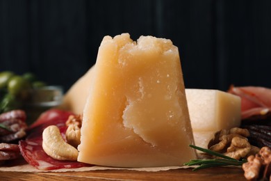 Photo of Piece of parmesan cheese on snack platter, closeup
