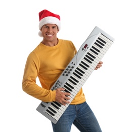 Photo of Man in Santa hat playing synthesizer on white background. Christmas music