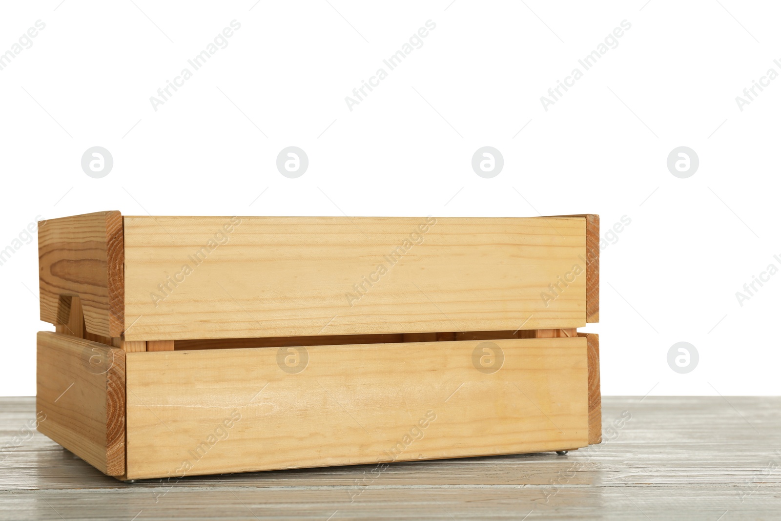 Photo of Empty rustic wooden crate on table against white background