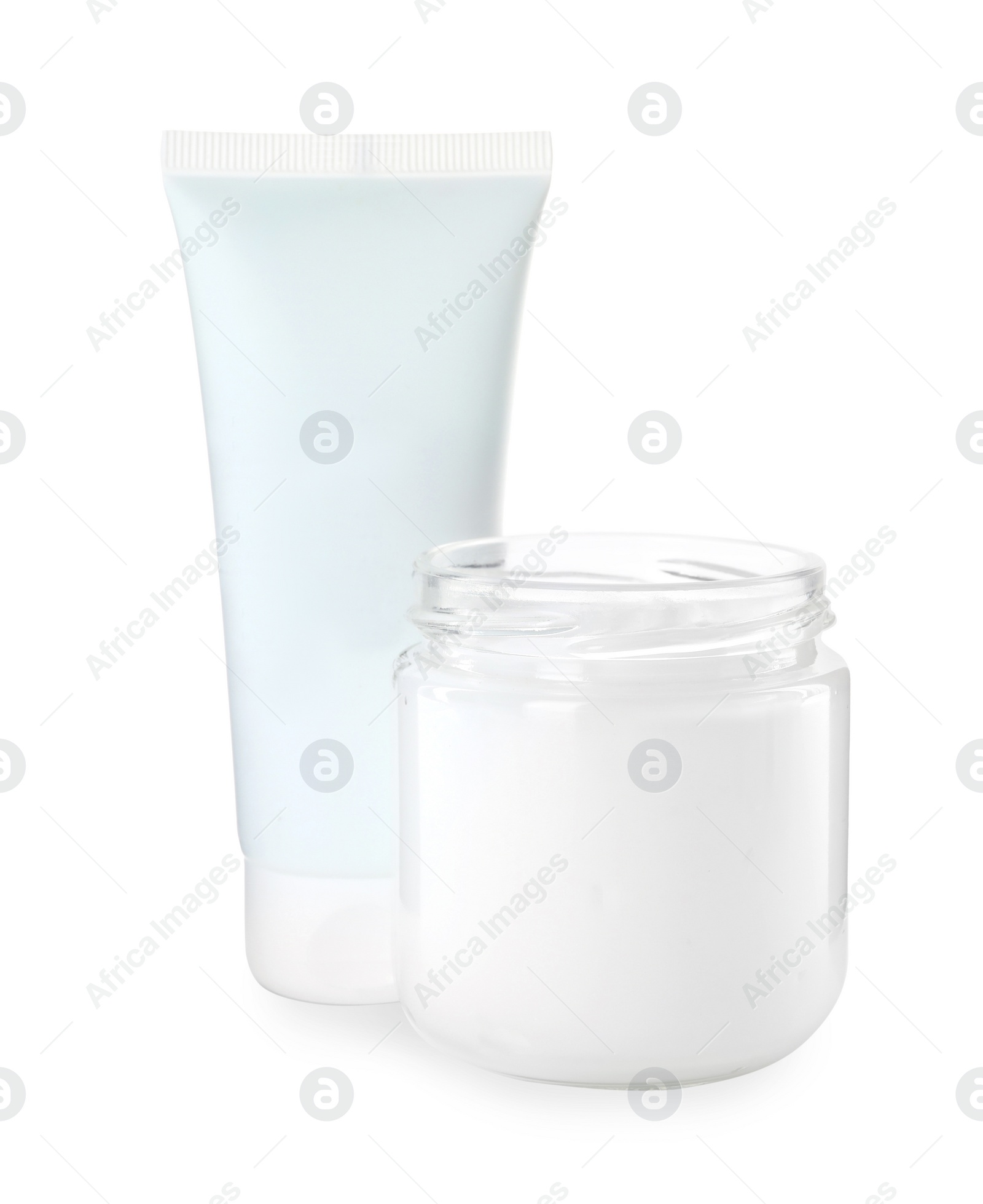 Photo of Jar and tube of hand cream on white background