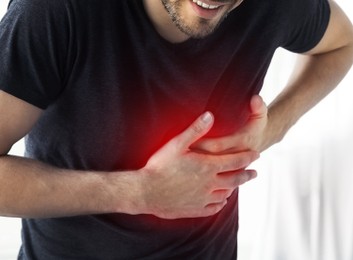 Image of Man having heart attack at home, closeup