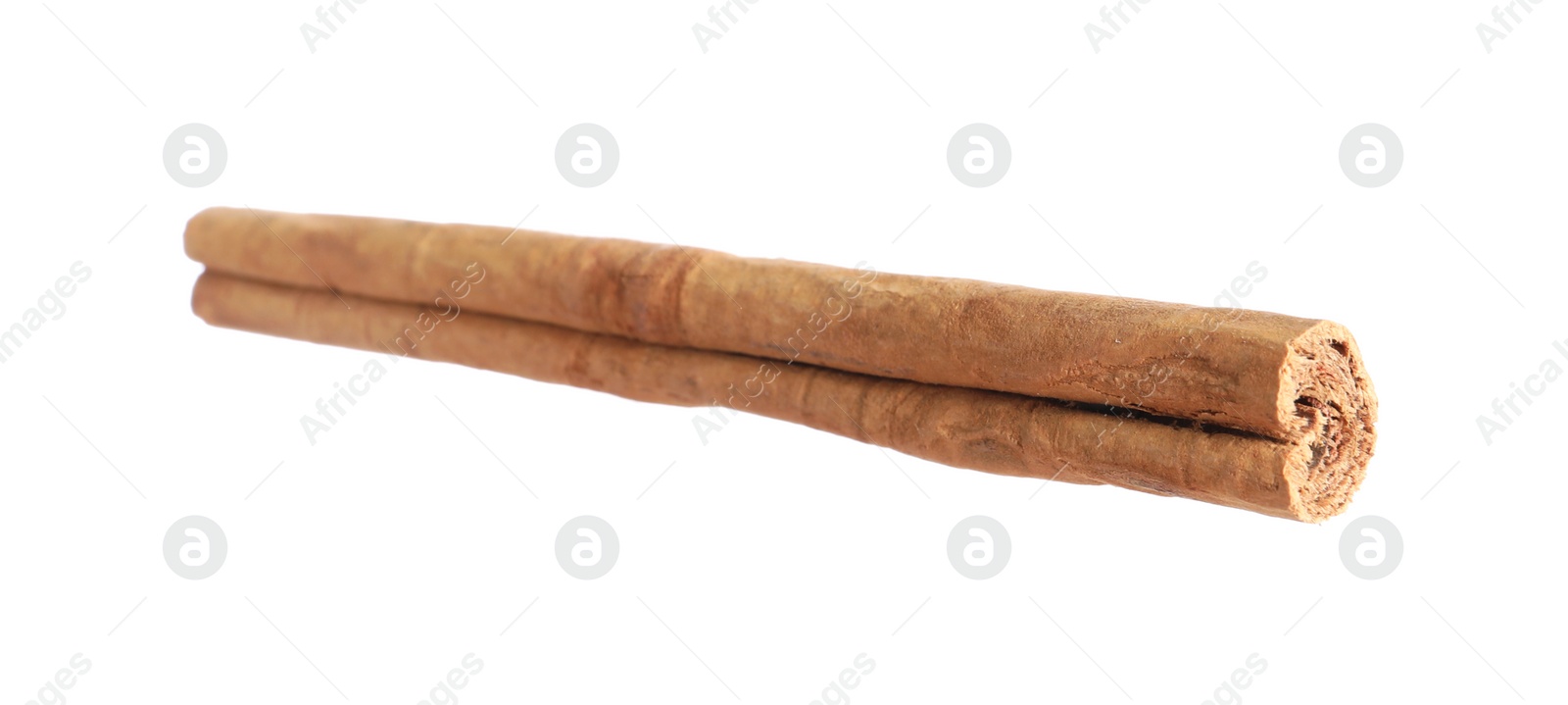 Photo of One aromatic cinnamon stick isolated on white