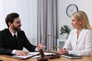Photo of Woman having meeting with lawyer in office