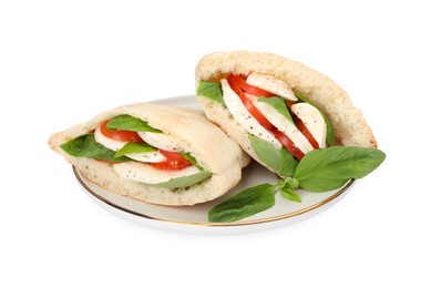 Photo of Plate of delicious pita sandwiches with mozzarella, tomatoes and basil isolated on white