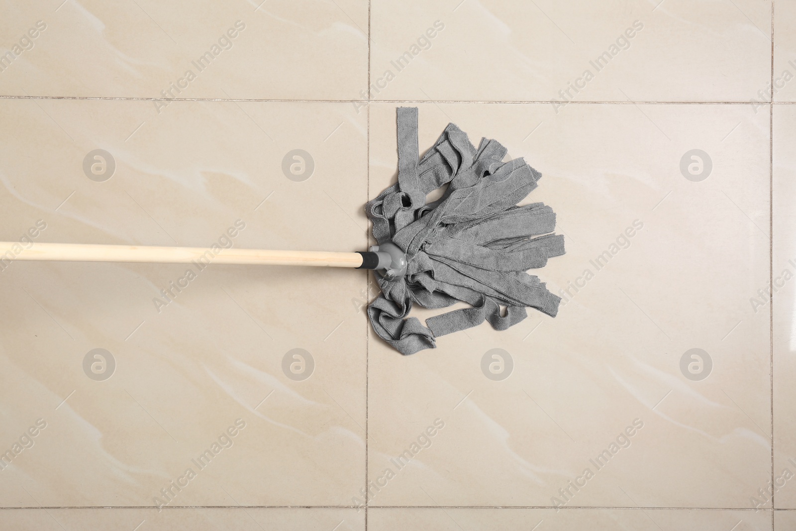 Photo of Cleaning of floor with mop, top view