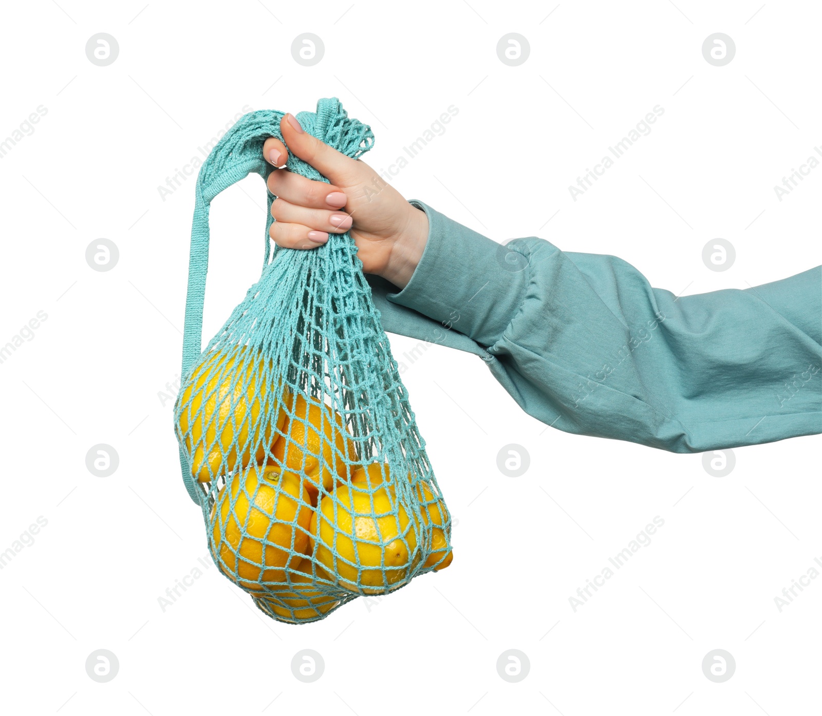 Photo of Woman with string bag of fresh lemons on white background, closeup