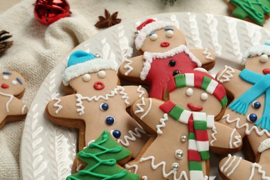 Photo of Delicious Christmas cookies and anise on fabric, closeup