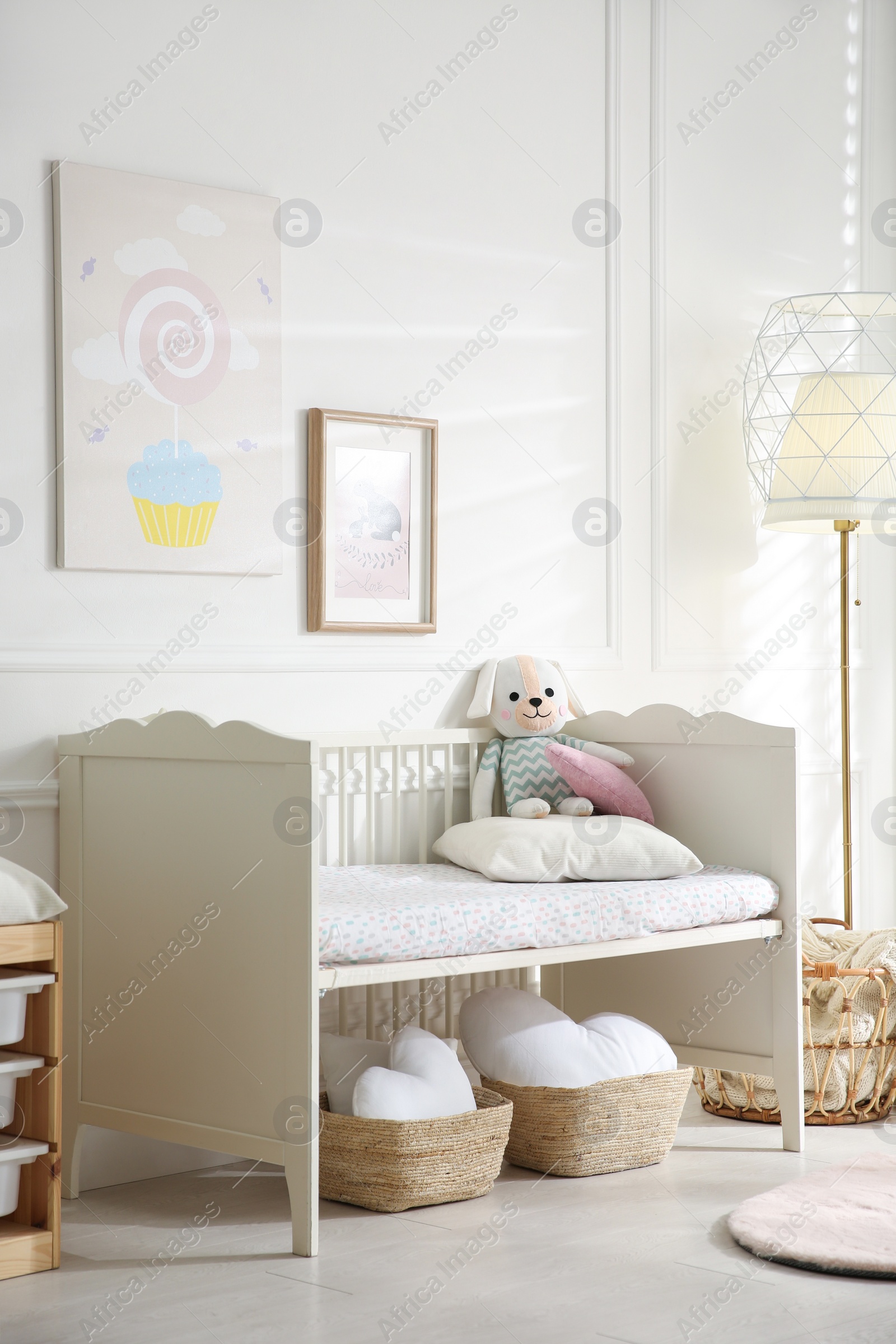 Photo of Baby room interior with stylish furniture and toys