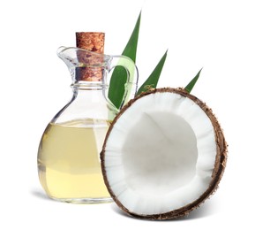 Bottle of coconut cooking oil and fruit on white background