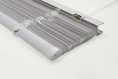 Photo of Stylish horizontal window blinds on white background