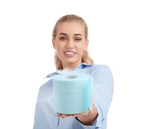 Beautiful young woman holding toilet paper roll on white background